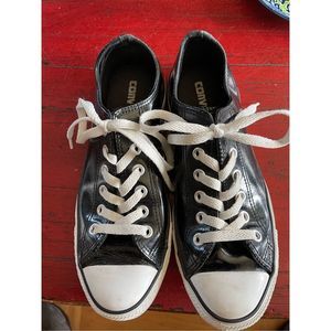 Black vinyl converse tennis shoes